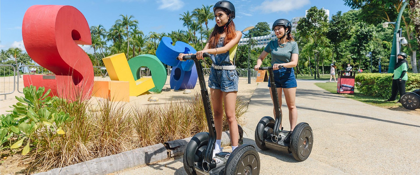 Friends having fun with Segway along the Siloso beach with Gogreen
